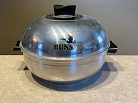 Full view of West Bend aluminum serving oven with lid and handles