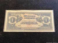 Front of WWII Japanese Government one dollar note showing tropical imagery, bilingual text, denomination