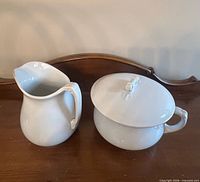 Pitcher and covered bowl displayed together