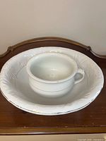 Wash basin with chamber pot nested inside showing size and style