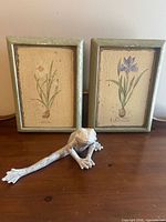 Frog figurine and both framed prints together