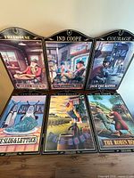 All six wooden pub sign plaques displayed upright
