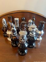 Group of 12 Avon chess piece bottles front view