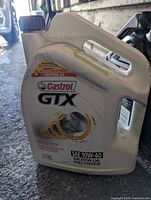 Front view of sealed 5L Castrol GTX motor oil jug