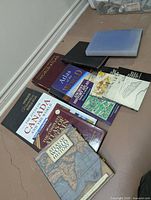 Group of atlases including The Times Atlas of the World and several other large cartographic references