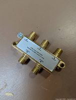 Top view of the 4-way coax cable splitter showing connectors, label and frequency range