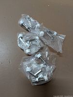 Five individually bagged hinge stop inserts