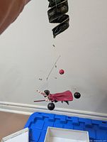 Overall view of Harry Potter Quidditch mobile with figure, balls, ribbon and wires