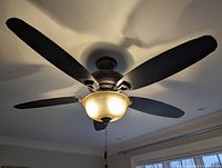 Overall view of installed Hunter ceiling fan with light on