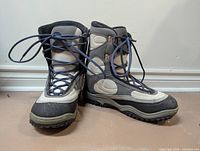 front and side view of both Lamar snowboard boots showing overall design, colour and lace system