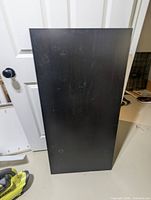 Front view of black laminated panel