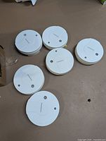 Top view of six Garrison smoke detectors
