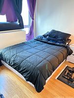 Box frame beneath mattress, partial white base visible