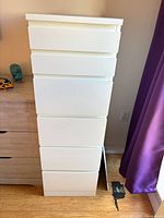 Front view of white 6-drawer dresser