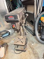 Front angled view showing Jobmate branding, feed handles, table, base, power cord