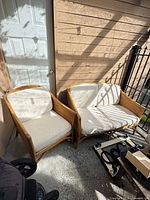 Armchair and loveseat side by side showing overall design and condition