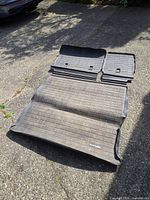 Three-piece cargo liner set laid out to show all parts