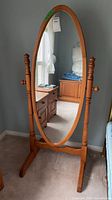 Front view of pine oval swivel mirror