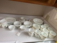Full grouping of Corelle dinnerware on countertop