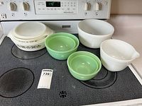 Group view of all casseroles and mixing bowls on stovetop