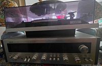 Front view of Yorx turntable stacked on Nikko STA-6060 receiver