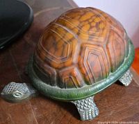 Angle showing stained glass shell and metal head