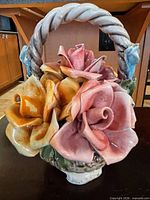 Overall view of Capodimonte porcelain flower basket figurine