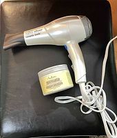 ConairPro hair dryer beside SheaMoisture conditioner jar