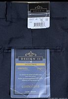 Close-up of labels showing brand, size 36, length 32, fabric details