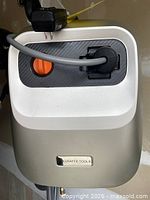 Front view of Giraffe Tools pressure washer housing showing power cable and hose connection