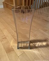 Full view of clear glass square vase standing upright