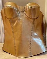 Front view of gold metallic leather longline corset