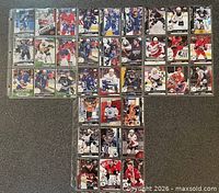 T-shaped layout of binder pages showing roughly 36 sleeved hockey cards front side