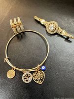 Ring, bangle and brooch front view