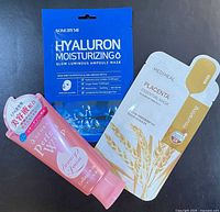 Front of all three sealed items: Senka cleanser tube, Some By Mi blue mask sachet, Mediheal white-gold mask sachet