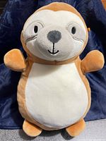 Front view of brown and white Squishmallows sloth plush