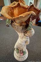 front view showing figure and flower bowl