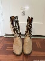 Front view of both boots showing overall condition and toe creasing