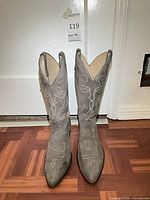 Front view of both boots showing toe shape, stitching and overall wear