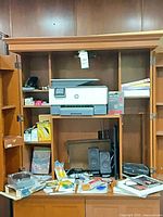 Shelf with printer, speakers, scale box, SD card, keyboard and misc items