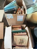 Two boxes filled with assorted craft and quilting books