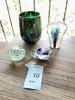 Four art glass pieces grouped on table