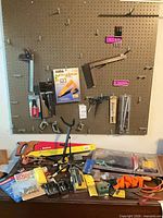 Overall view showing pegboard, hooks, tools and accessories