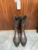 Front view of brown leather cowboy boots