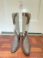 Pair of boots front view showing vamp quill texture and shaft color contrast