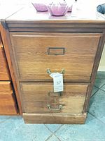 Front view of oak veneer 2-drawer filing cabinet