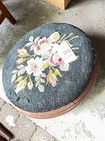 Full view of top showing floral needlepoint design