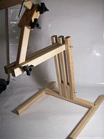 overall view of wooden adjustable stand in side profile