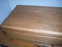 Rectangular wooden lidded storage box with brass knob