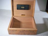 Humidor open showing cedar interior and Calabresi humidifier